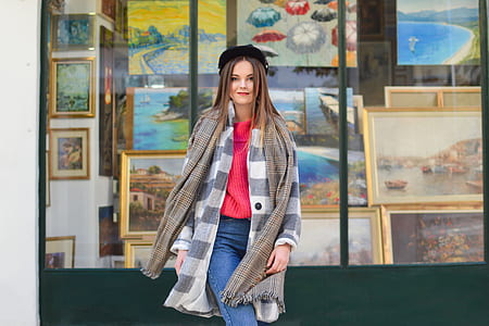 woman standing in front of store facade thumbnail