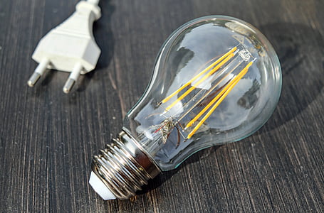 clear and gray light bulb and white power cord thumbnail