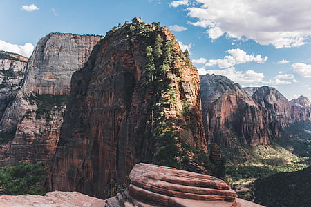 landscape photo of rock mountains during daytime thumbnail
