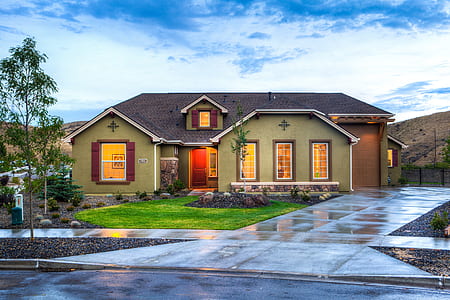 photo of brown house near road thumbnail
