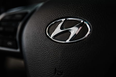 Shallow Focus Photography of Hyundai Emblem thumbnail