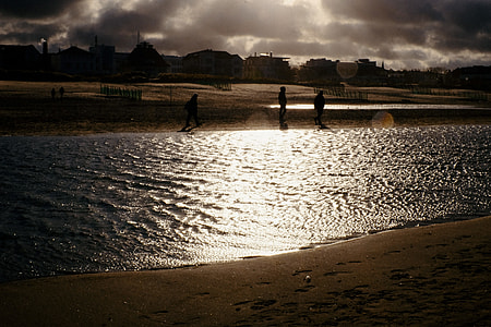 Walkers on a beach thumbnail