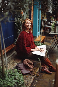Smiling Woman Sitting on Stairs thumbnail