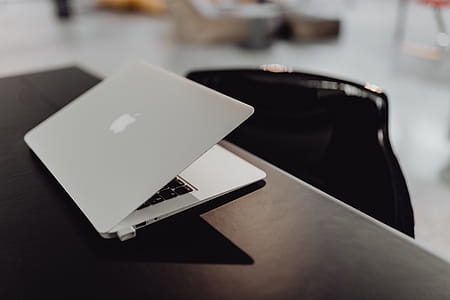 Stylish workspace with MacBook computer on home or studio thumbnail