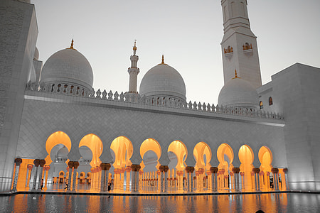 white mosque under cloudy sky thumbnail
