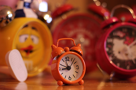selective focus photography of orange alarm clock at 8:57 thumbnail