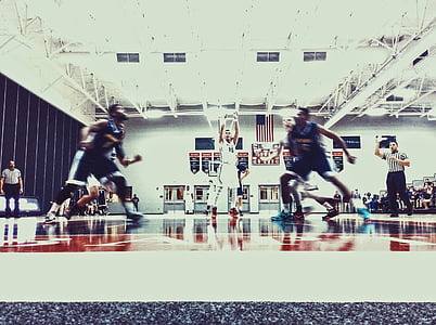 basketball player playing indoor basketball thumbnail