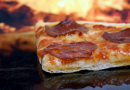 slice of pizza in oven thumbnail