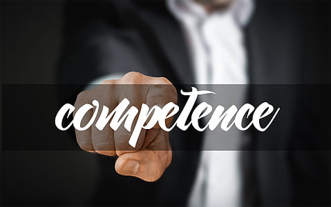 person pointing towards competence word thumbnail