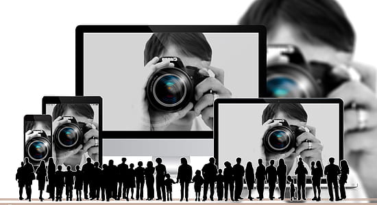 person holding DSLR camera thumbnail