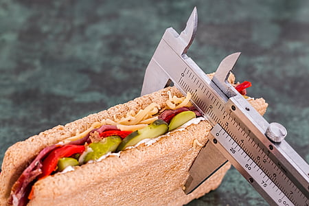 sandwich being measured by gray vernier caliper thumbnail
