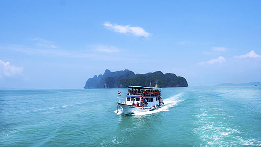 white boat on body of water thumbnail