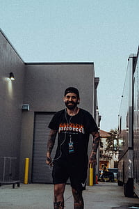 man walking on street with earphones thumbnail