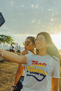 woman wearing white crew-neck t-shirt thumbnail