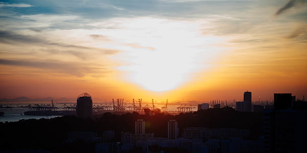 silhouette of buildings during sunset thumbnail