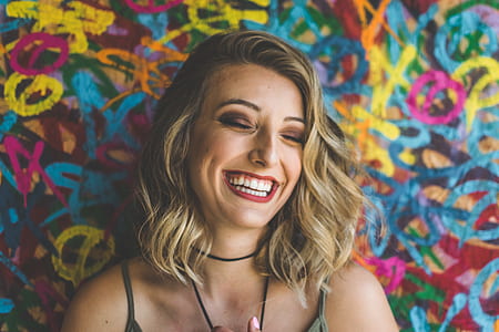 woman with red lipstick taking selfie thumbnail