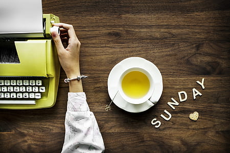 person holding green typewriter thumbnail