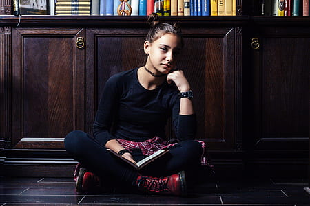 photography of woman sitting indoors thumbnail