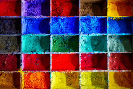 close-up photo of assorted-color powders on wooden rack thumbnail