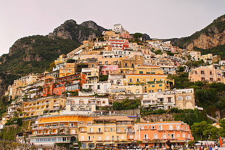 beige and orange building on mountain thumbnail