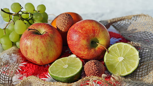 sliced citrus and two red apple fruits thumbnail