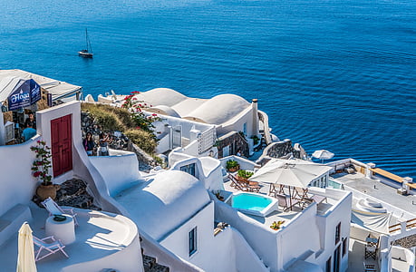 top view photography of house near body of water during daytime thumbnail