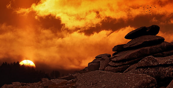 rock under cloudy sky during sunset thumbnail