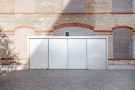 closed white metal door at daytime thumbnail
