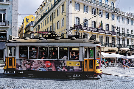 group of people riding tram during daytime thumbnail