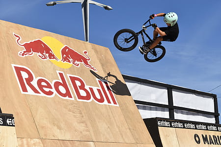 man playing BMX on Red Bull ramp during daytime thumbnail