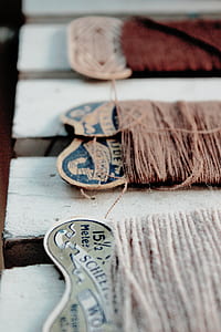 three threads on white wood thumbnail