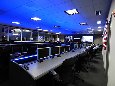 two men using computers in room thumbnail