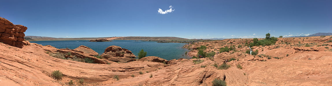brown mountain beside body of water thumbnail