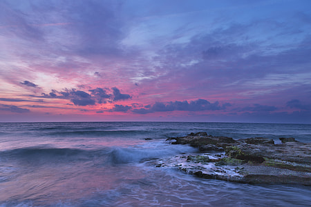 body of water under cloudy skies thumbnail