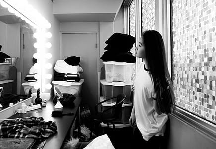 woman facing vanity mirror thumbnail