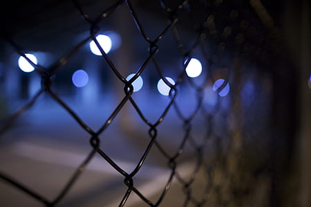 focus photography of black chain-link fence with bokeh background photography thumbnail