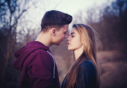 selective focus photo of man and woman about to kiss thumbnail