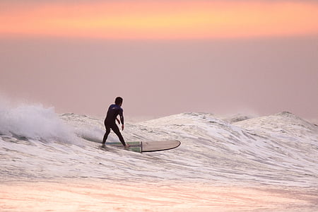 man riding surfboard thumbnail