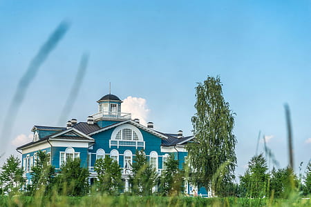 low angle photo of blue and white house thumbnail