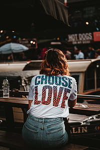 person in white shirt and blue denim short thumbnail