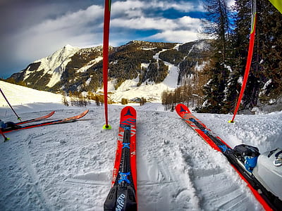 person riding ski blades on glacier mountains during daytime thumbnail