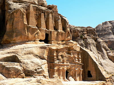 beige rock formation under clear sky thumbnail