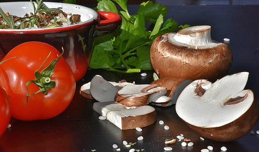 red tomato and brown mushroom on black table thumbnail