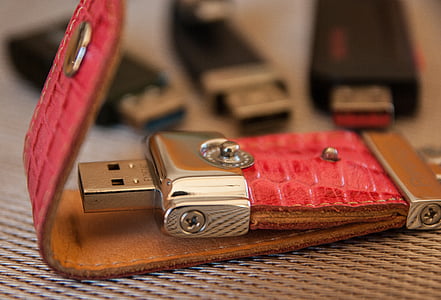 closeup photo of red and gray USB flash drive thumbnail
