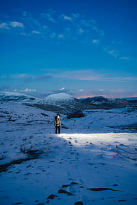 man standing on snowy mountain thumbnail