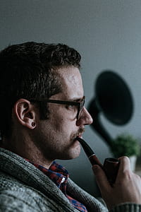 man holding smoking pipe thumbnail