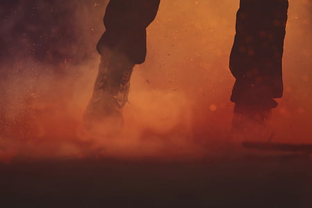 person wearing black lace-up boots thumbnail