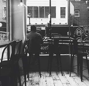Monochrome Photography of a Man Sitting on the Chair thumbnail