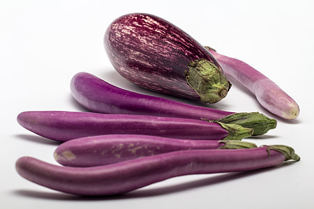 eggplants on white surface thumbnail