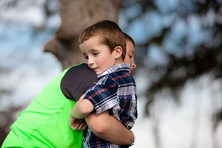 two boys embracing thumbnail